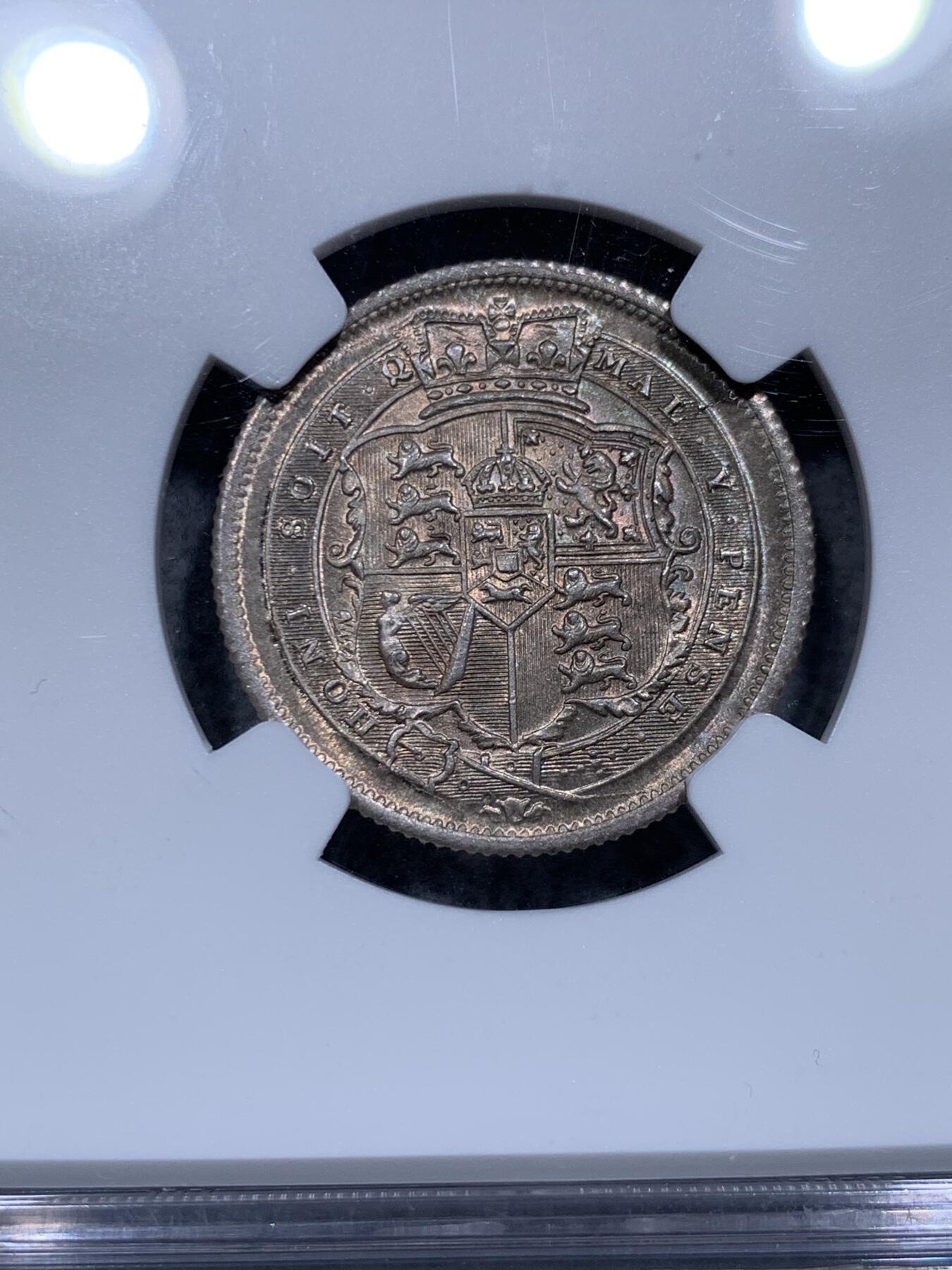 《竞宝斋》第315场 周日，周一，周二  3场连拍 （全场包邮） NGC MS65 英国1816年 乔治三世牛头1先令银币。好包浆好状态，来自皮斯特鲁奇的经典设计，分数够玩了，稀奇有2750的落槌价。