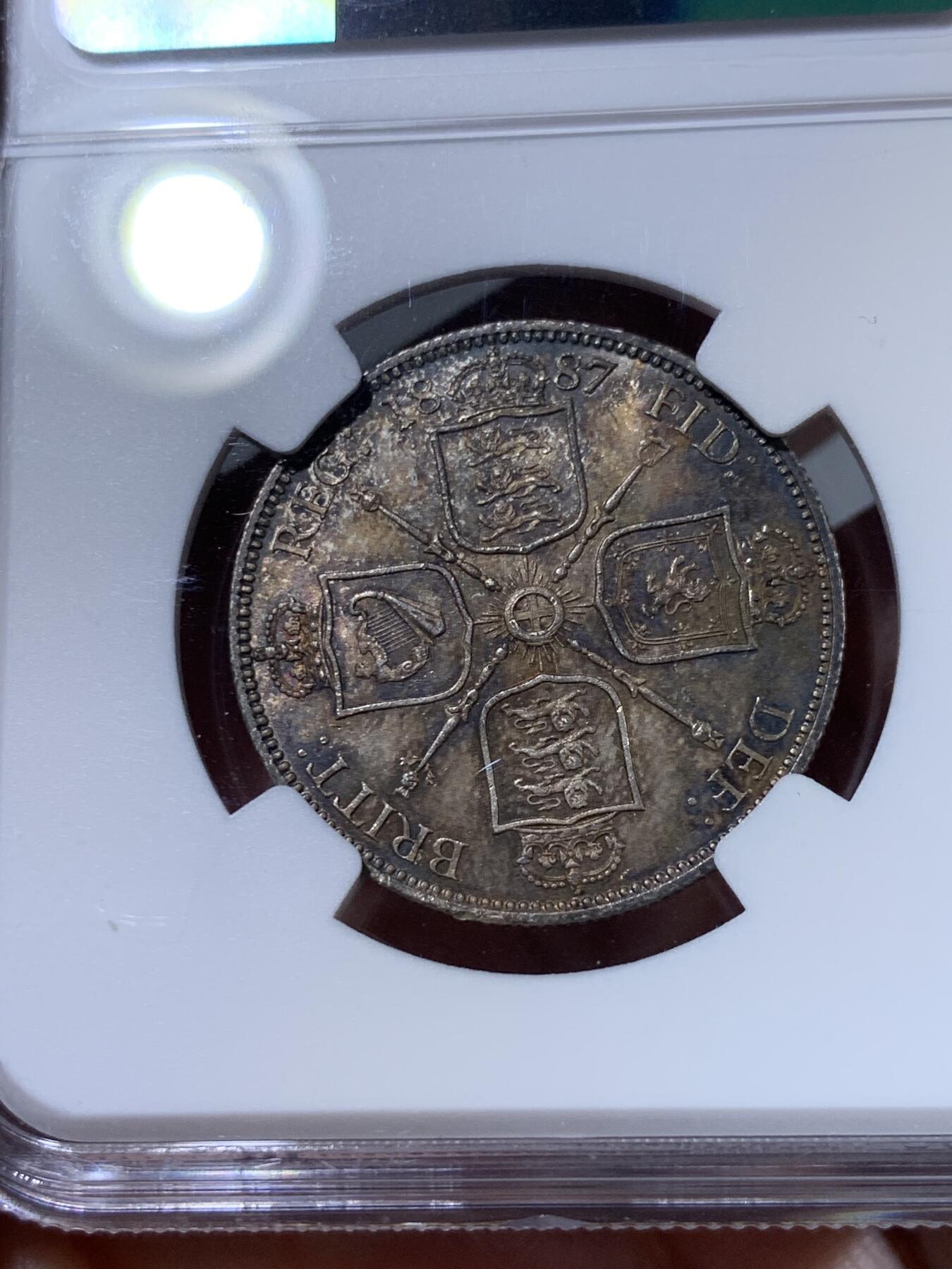 《竞宝斋》第318场 周日，周一 2场连拍 （全场包邮） NGC MS64 1887维多利亚高冠弗洛林银币，顶级酱彩均匀包浆，收藏级别的品相，一步到位！