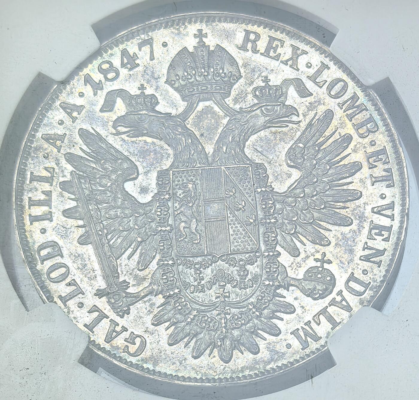 凡希社世界钱币微拍第二百八十六期 荐！1847奥地利帝国斐迪南一世双头鹰泰勒大银NGC-MS62，典型欧陆铁灰包浆，侧光下呈钴蓝五彩，光泽柔和而富有层次，视觉感一流的经典品种！