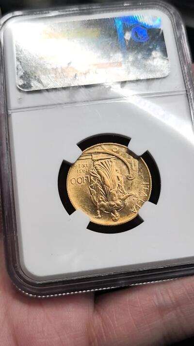 FXS世界钱币微拍第二百八十七期 荐！1931意大利埃曼努尔三世100里拉金币NGC-MS61，船首女神手持火炬与橄榄枝，精美的意大利钱币设计，8.8g，900金。