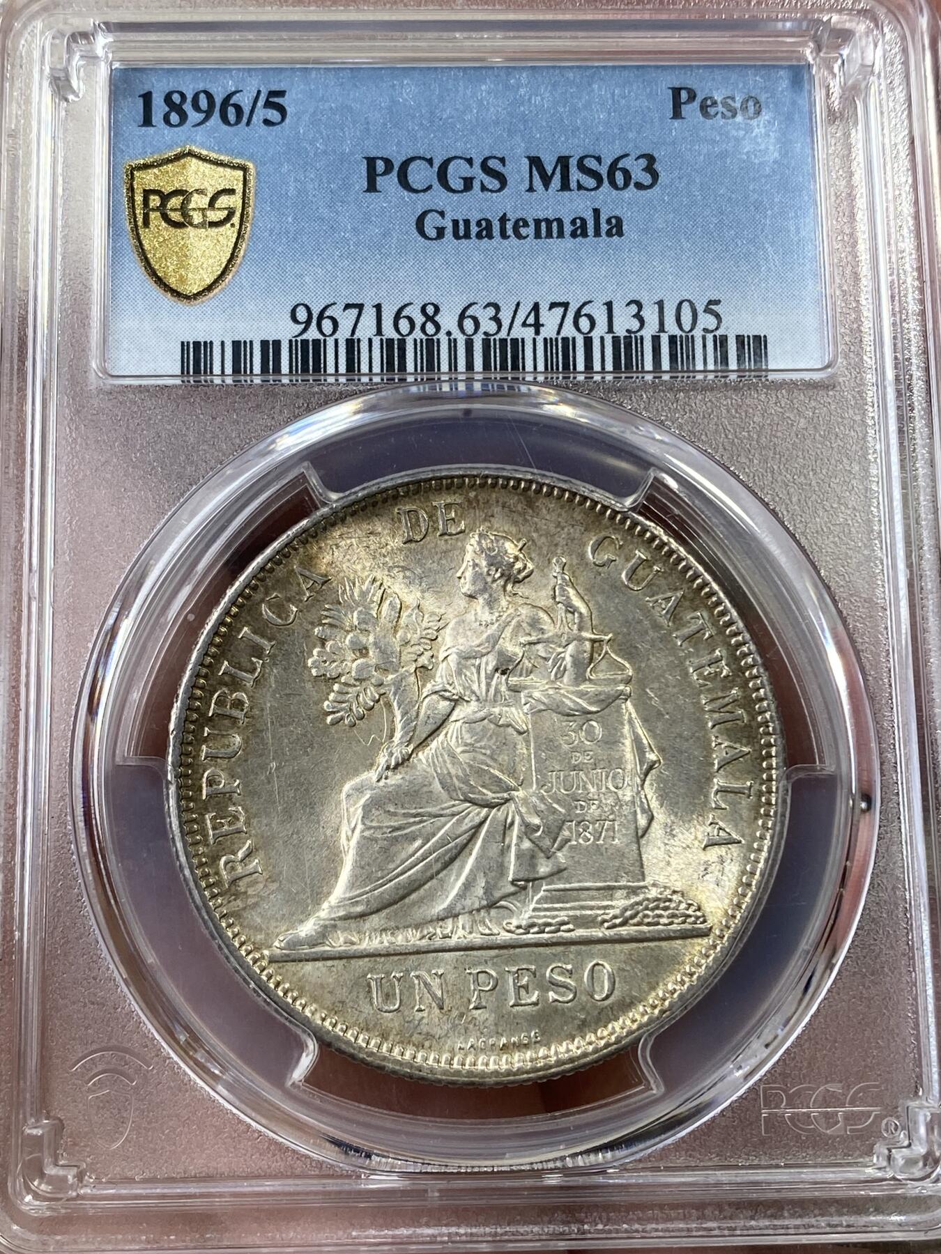 万国钱币拍卖第036期 PCGS MS63 1896/5年危地马拉女神1比索大银币 车轮转光搭配淡金包浆 骑字高分极其难得 南美潜力品种