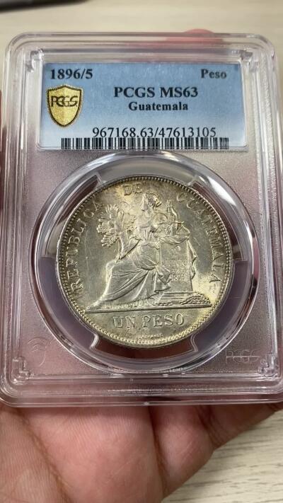 万国钱币拍卖第036期 PCGS MS63 1896/5年危地马拉女神1比索大银币 车轮转光搭配淡金包浆 骑字高分极其难得 南美潜力品种