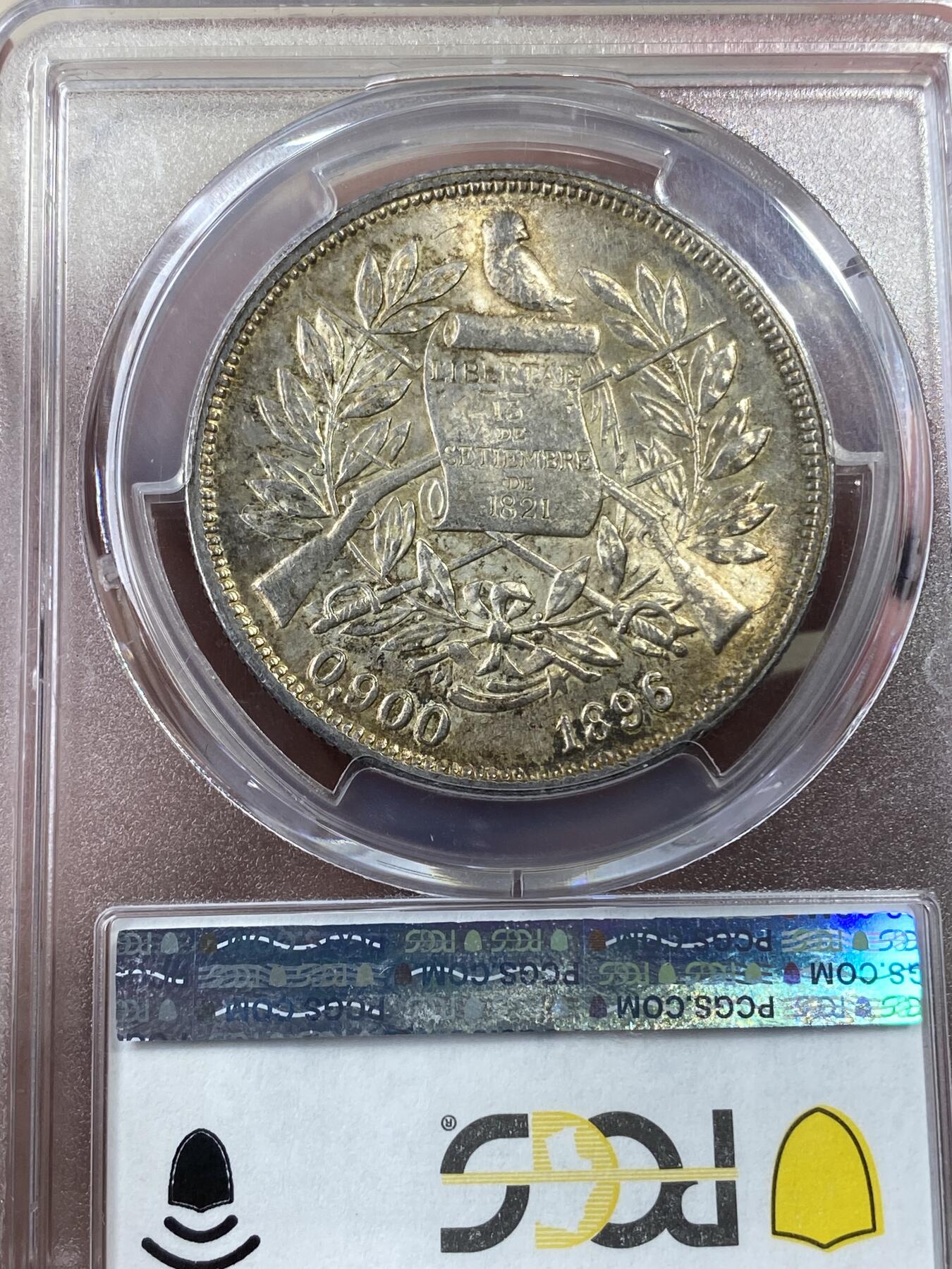 万国钱币拍卖第036期 PCGS MS63 1896/5年危地马拉女神1比索大银币 车轮转光搭配淡金包浆 骑字高分极其难得 南美潜力品种