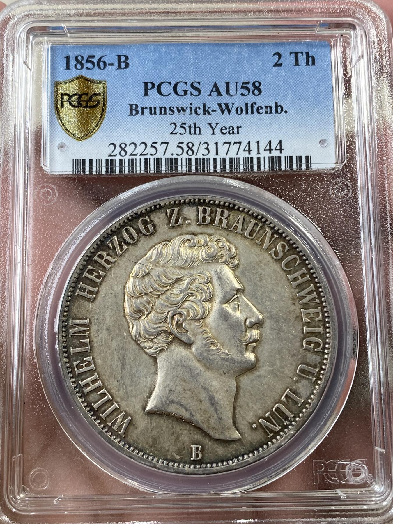 万国钱币拍卖第036期 PCGS AU58 1856年德国不伦瑞克-狼堡加冕25周年纪念流通2泰勒 经典登基品种 铸造精良 通体酱彩
