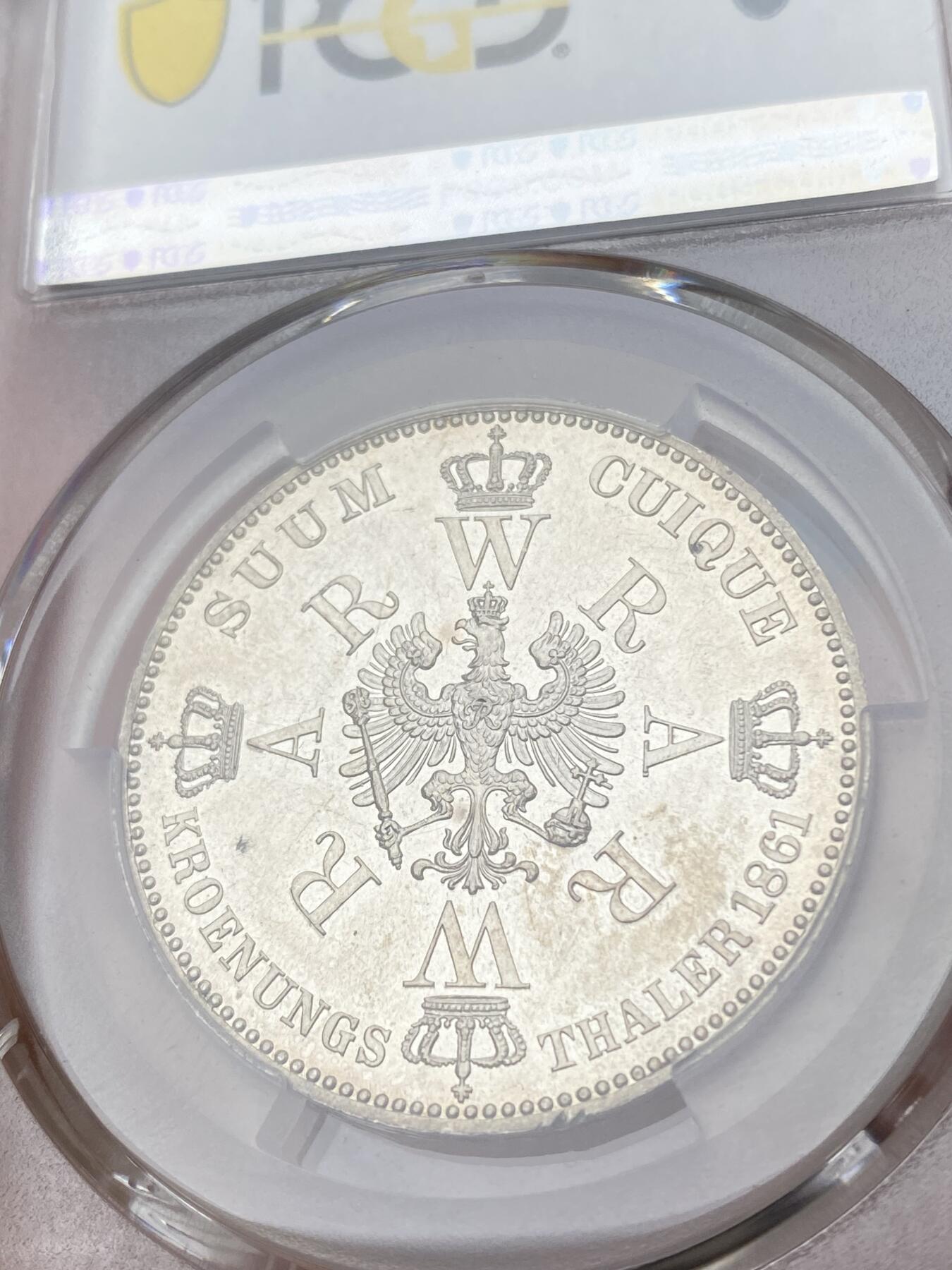 万国钱币拍卖第036期 PCGS MS62PL 1861年德国普鲁士威廉国王加冕纪念流通1泰勒 PL环彩镜面状态 极为不易的收藏品质