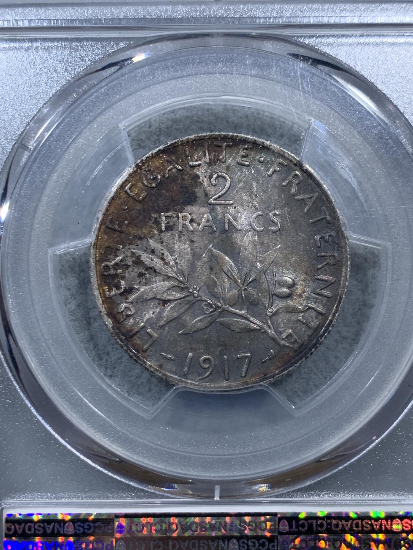 《竞宝斋》第322场 周日，周一，2场连拍 （全场包邮） PCGS MS64 法国1917年播种女神2法郎银币，充分流通品种，罗蒂经典设计。正面完美霜银光，背面原味卷首黑彩。能给重彩包浆币到64分，表明了评级师充分的认可