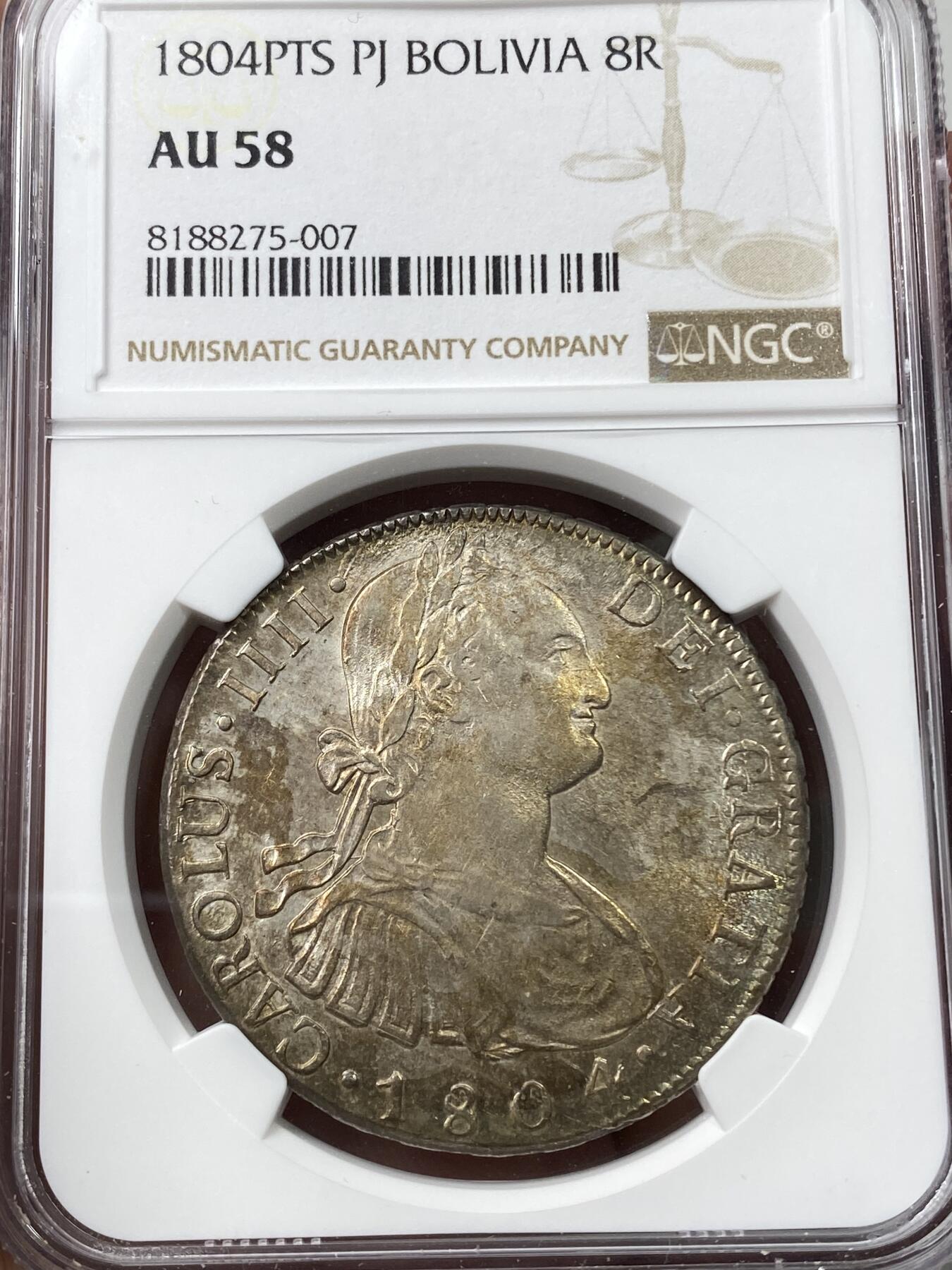 万国钱币拍卖第036期 NGC AU58 玻利维亚 1804年 卡洛斯四世 8里亚尔银币 高点细节具在 光感强烈 币面环状五彩黄油光包浆非常漂亮，严重低评的一枚 稀少厂别 实物惊艳
