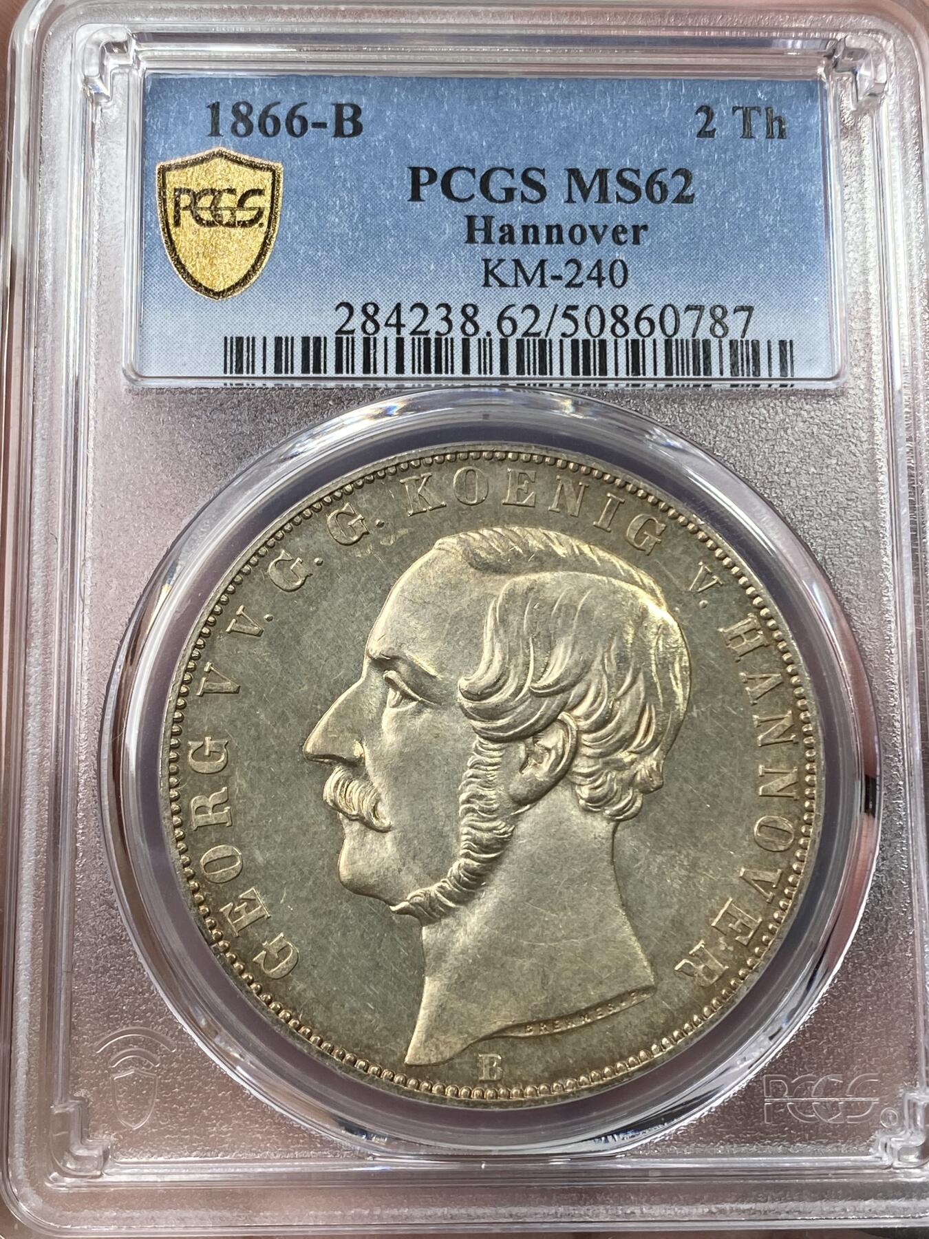 万国钱币拍卖第036期 PCGS MS62 1866年德国汉诺威狮马流通2泰勒 经典汉诺威狮马，黄金包浆加环七彩点缀，难度不小的流通2T系列，越来越贵的品种，前不久MDC的64已经3万+了。