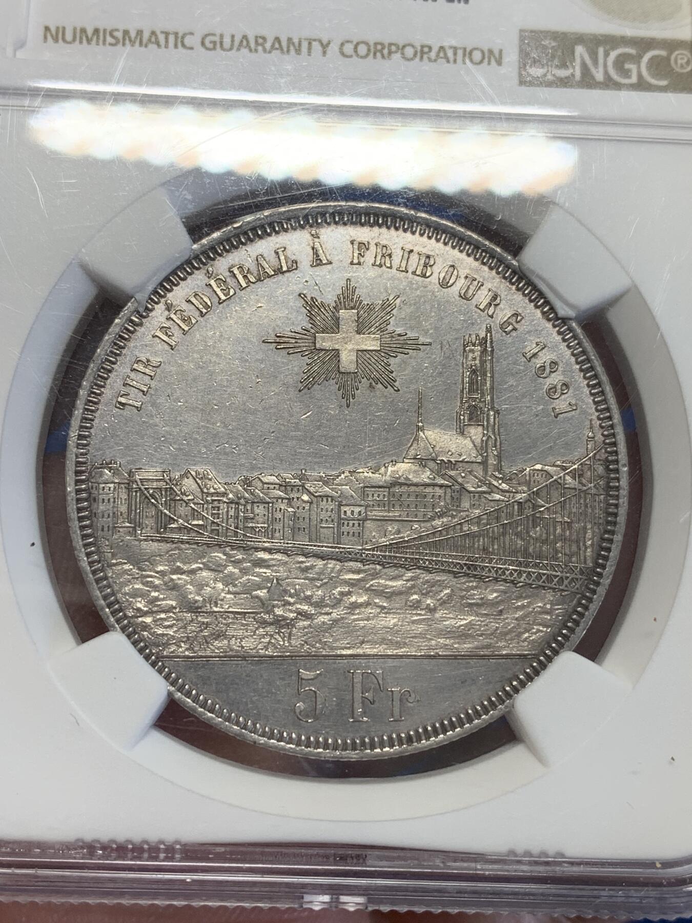 《竞宝斋》第323场 周日，周一，2场连拍 （全场包邮） NGC UNC 瑞士1881 弗里堡射击节5法郎大银币，景观不错，精美的瑞士币种