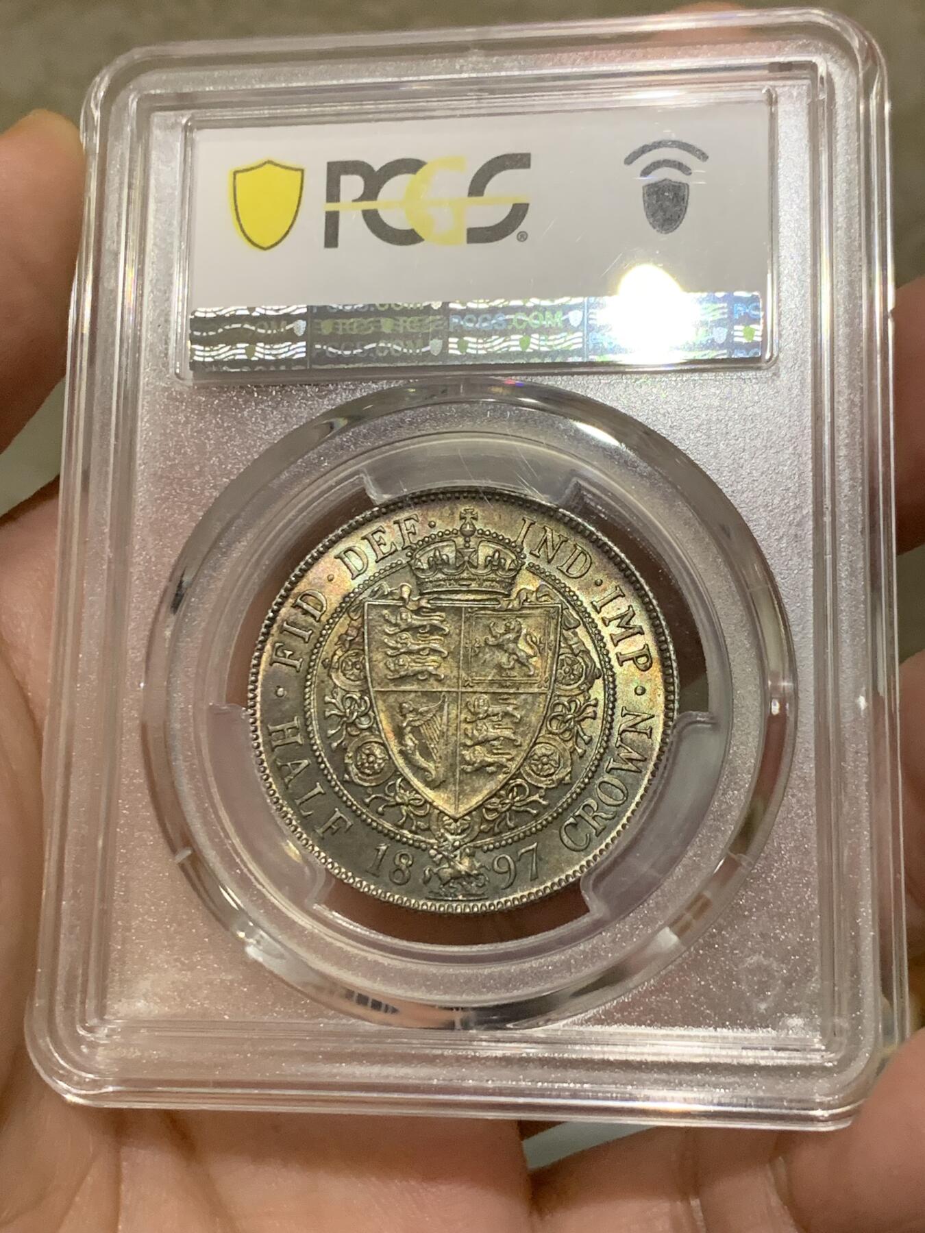 《竞宝斋》第323场 周日，周一，2场连拍 （全场包邮） PCGS MS63 英国1897老维半克朗银币，通体欧洲包浆，背面极好，带车轮光。人像面深打，脸蛋呼之欲出，一步到位的藏品！
