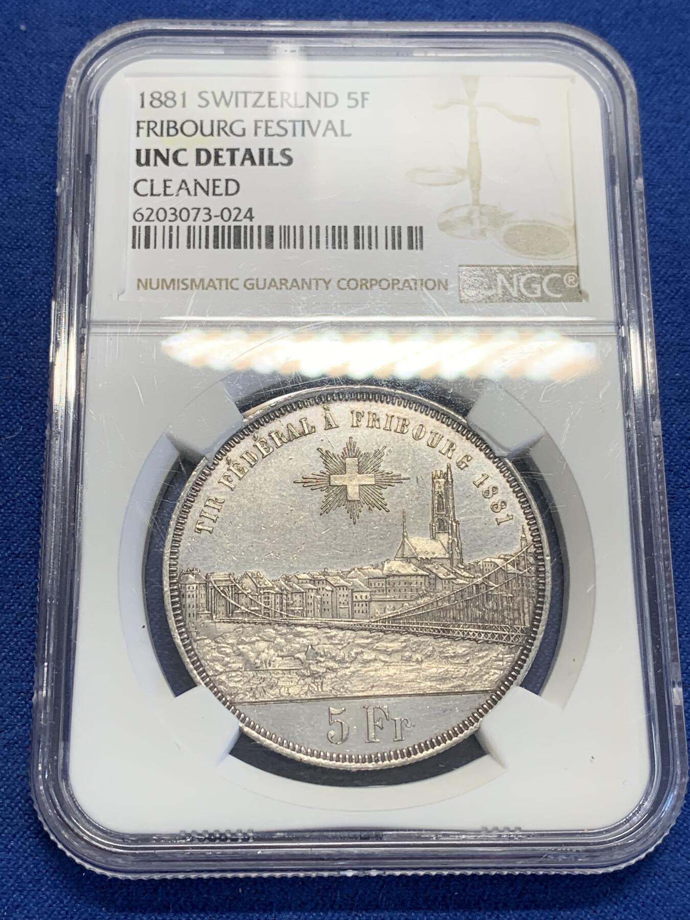 《竞宝斋》第323场 周日，周一，2场连拍 （全场包邮） NGC UNC 瑞士1881 弗里堡射击节5法郎大银币，景观不错，精美的瑞士币种