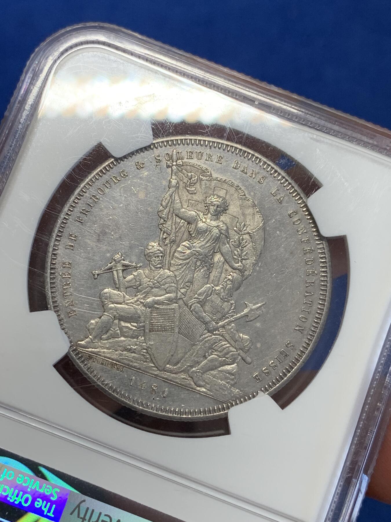 《竞宝斋》第323场 周日，周一，2场连拍 （全场包邮） NGC UNC 瑞士1881 弗里堡射击节5法郎大银币，景观不错，精美的瑞士币种