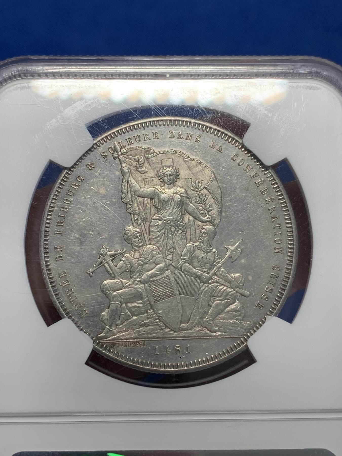 《竞宝斋》第323场 周日，周一，2场连拍 （全场包邮） NGC UNC 瑞士1881 弗里堡射击节5法郎大银币，景观不错，精美的瑞士币种