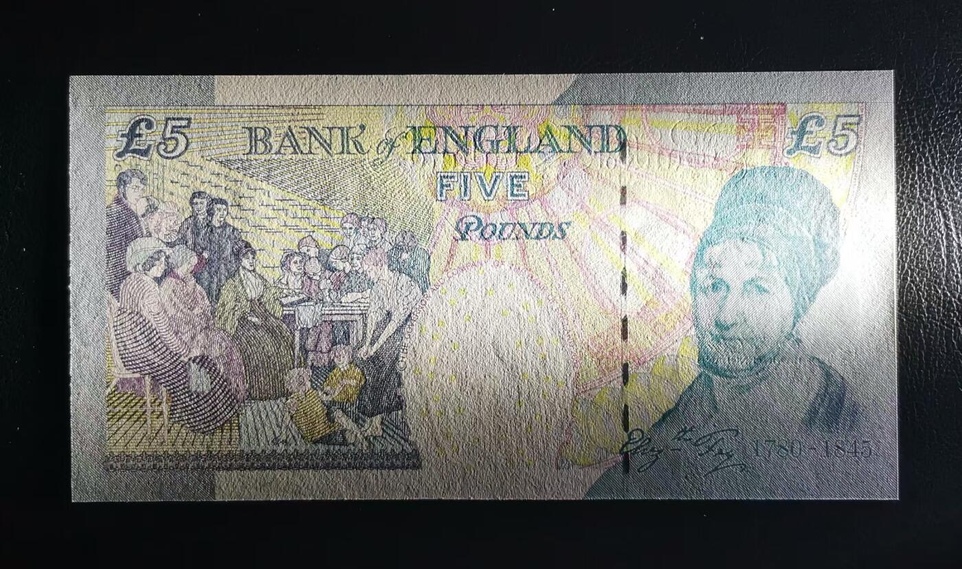 《张总收藏》173期-周日外币精选 英国E序列再版2002年5镑首发HA01冠千位7765号UNC-正面紫光灯下有轻微斑