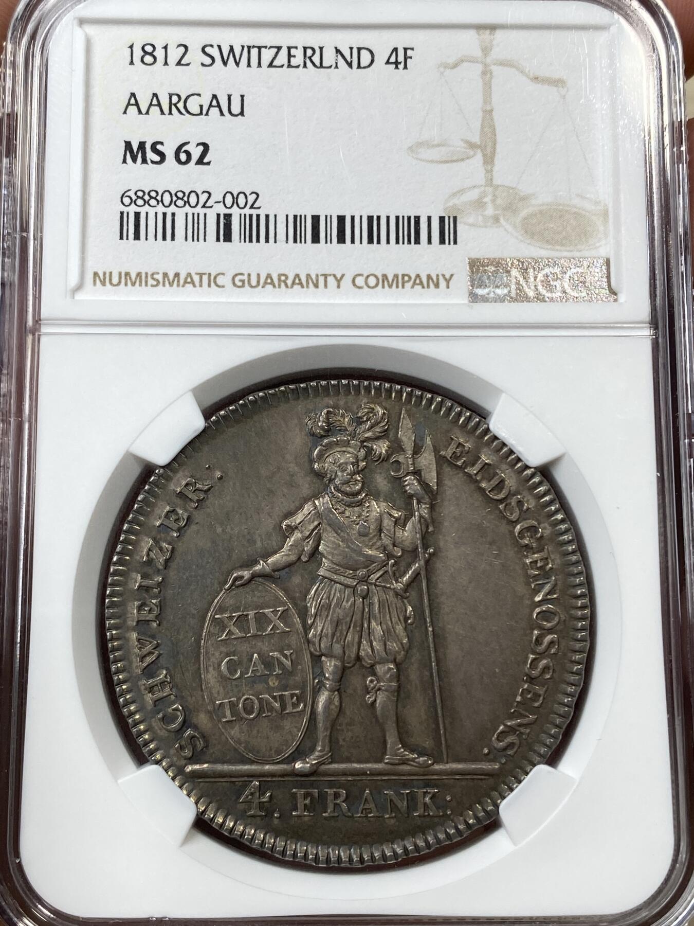 万国钱币拍卖第036期 NGC MS62 1812年瑞士阿尔高4法郎大银币 经典雇佣兵系列 单年发行2527枚 精工细作的克朗型大银 绝美七彩倒影包浆 收藏级品质 价值洼地品种