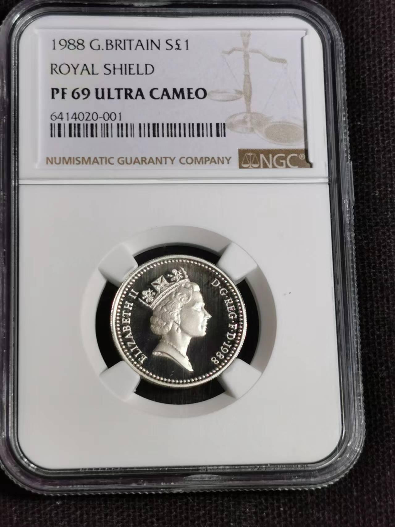 刘世昌艺术品销售中心～虎踞龙蟠*金杨在线联拍群第510期 英国1988年1镑“伊丽莎白-皇家盾牌”精制纪念银币（NGC    PF69UC    串号：6414020-001）1枚。