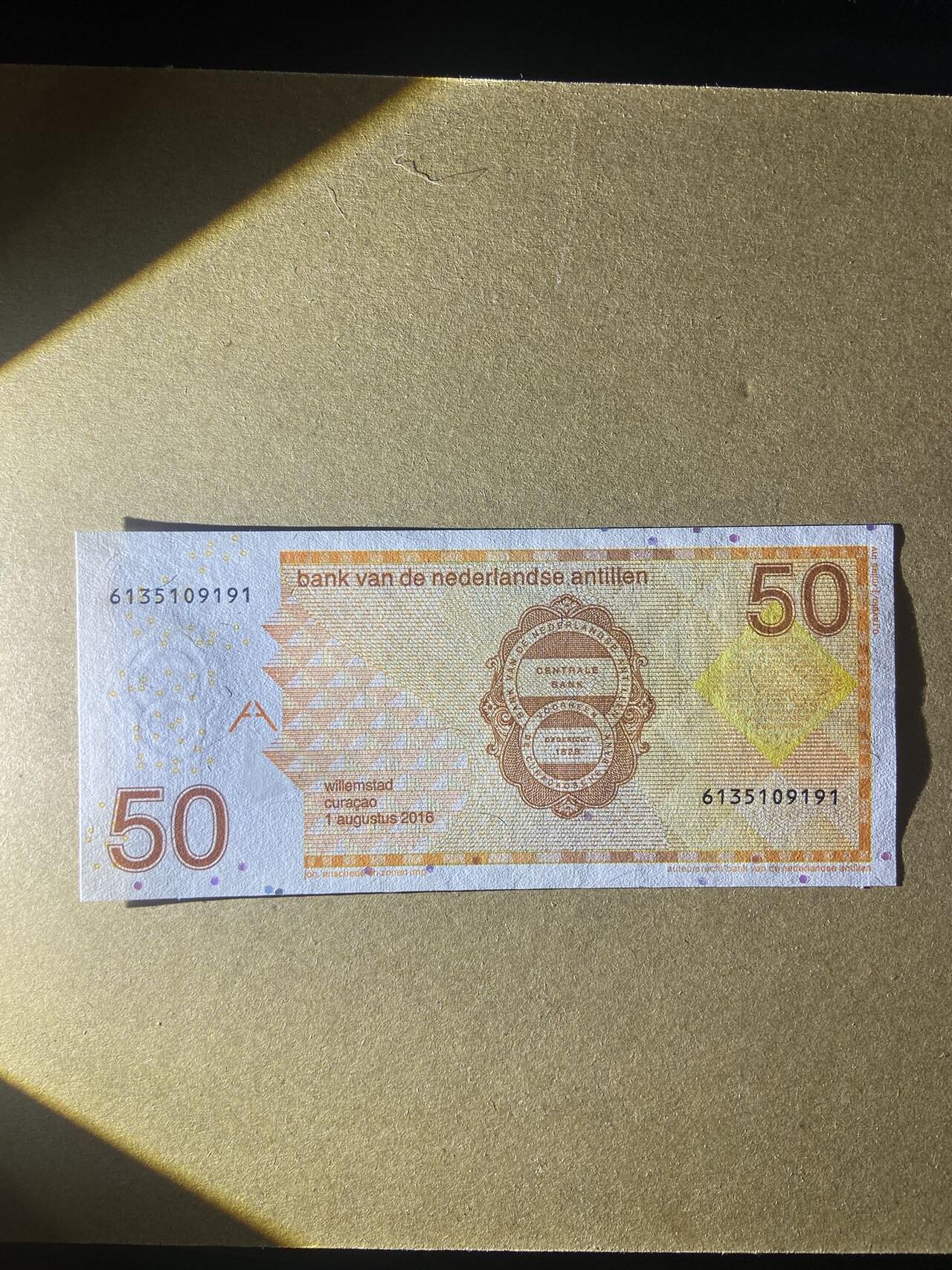 【炜奕收藏】，第十八期 荷属安德烈斯50盾，UNC品相，号码无47