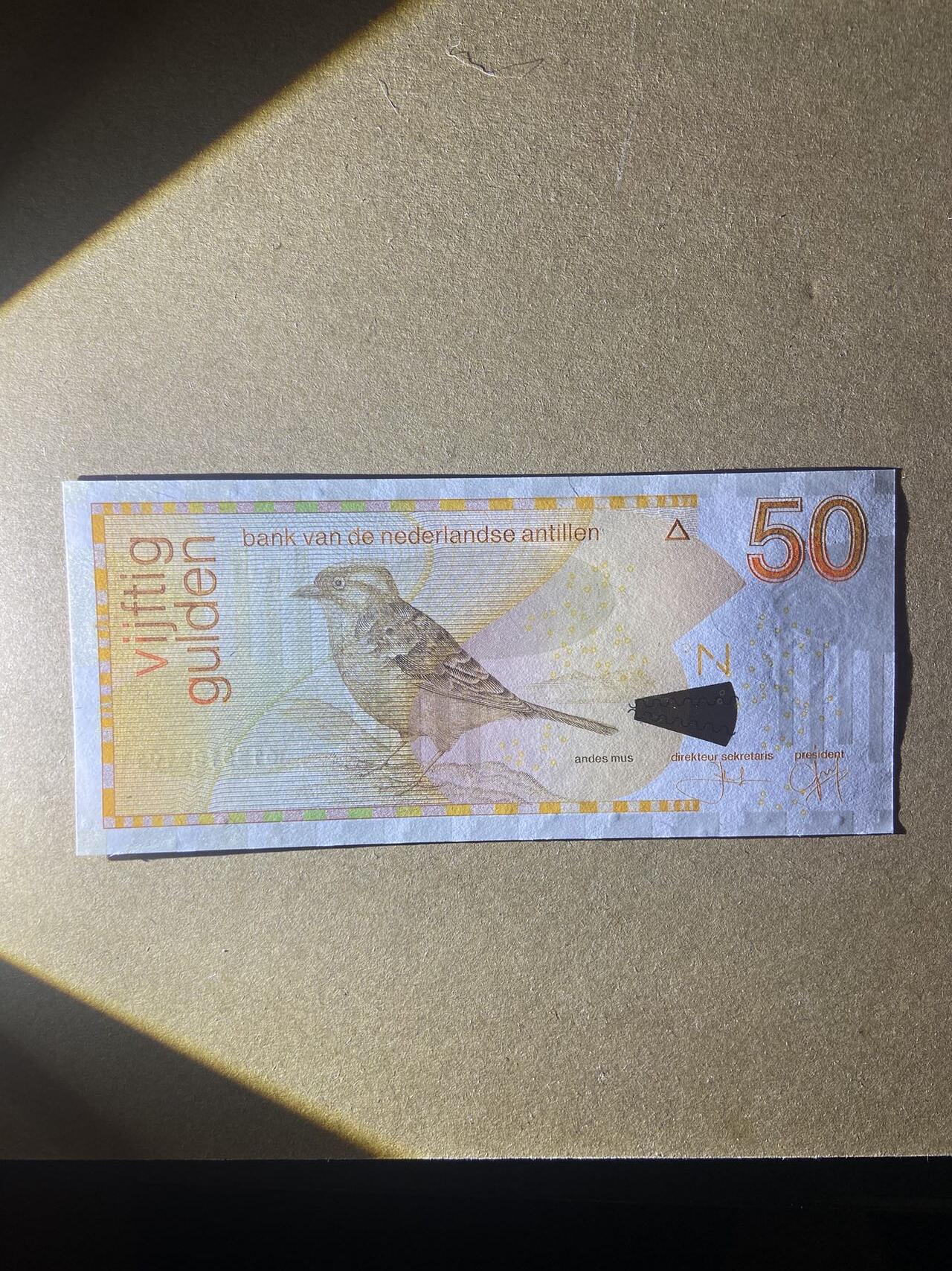 【炜奕收藏】，第十八期 荷属安德烈斯50盾，UNC品相，号码无47