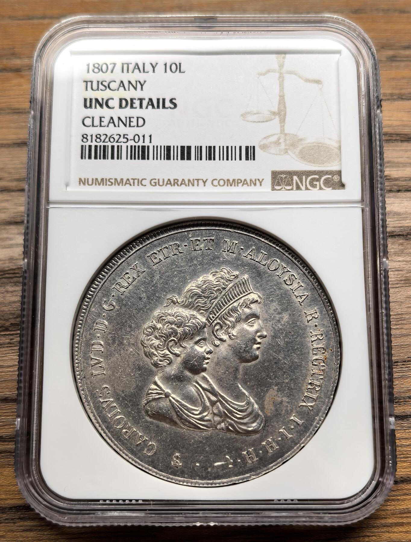 凡希社世界钱币微拍第二百八十九期 1807意大利托斯卡纳母与子10里拉大银NGC-UNCD，没分但整体细节出色，适合纸袋保存的藏家品质。