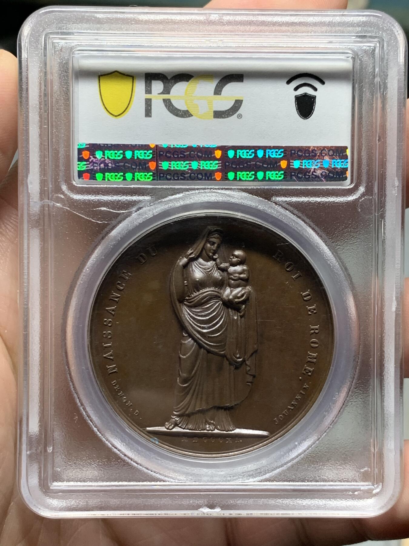 《竞宝斋》第326场 周日，周一，2场连拍 （全场包邮） PCGS SP63 法国1811拿破仑二世罗马王原铸铜章 拿破仑纪念儿子罗马王诞生 堪称拿破仑妻儿宫廷肖像画 一面是拿破仑妻子路易丝王后怀抱新生婴儿 另一面拿破仑二世圆滚滚婴孩可爱形象 与哈布斯堡王朝联姻的血脉 为比肩古罗马帝国 拿破仑授予儿子