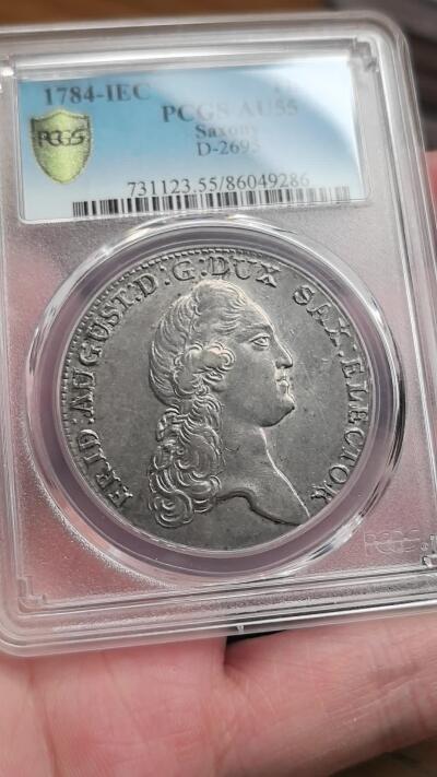 凡希社世界钱币微拍第二百八十九期 1784IEC德国萨克森选帝侯奥古斯塔盾徽泰勒大银PCGS-AU55，漂亮的淡紫金彩。(视频参考)