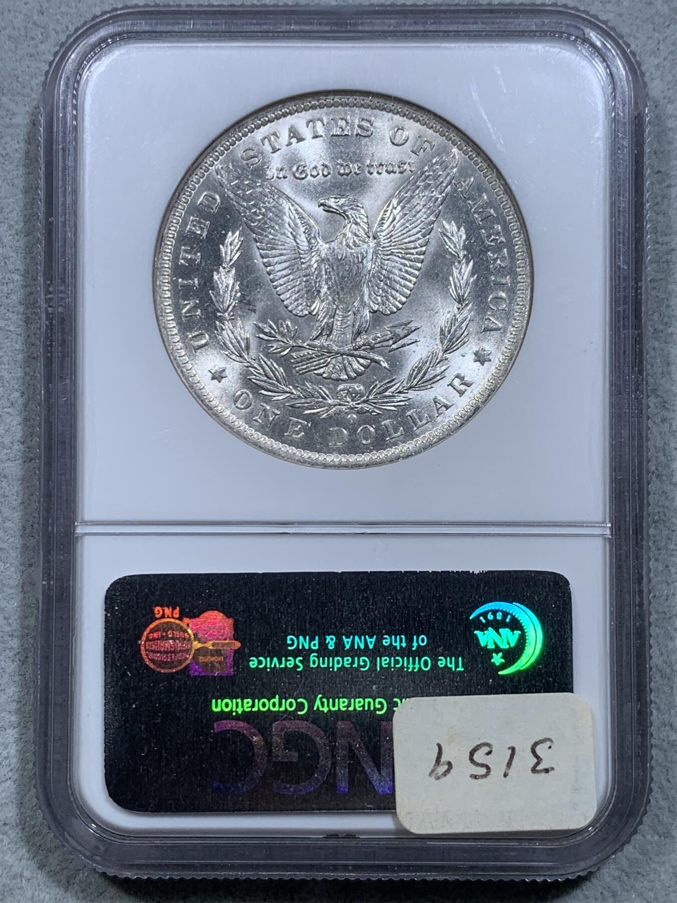 《竞宝斋》第326场 周日，周一，2场连拍 （全场包邮） NGC  MS64  美国1884年O版摩根银币，ngc老盒严评，无官网图，但终身保真。两面爆霜底板，出厂状态银霜，脸部无明显伤很少见。状态好于分数。
