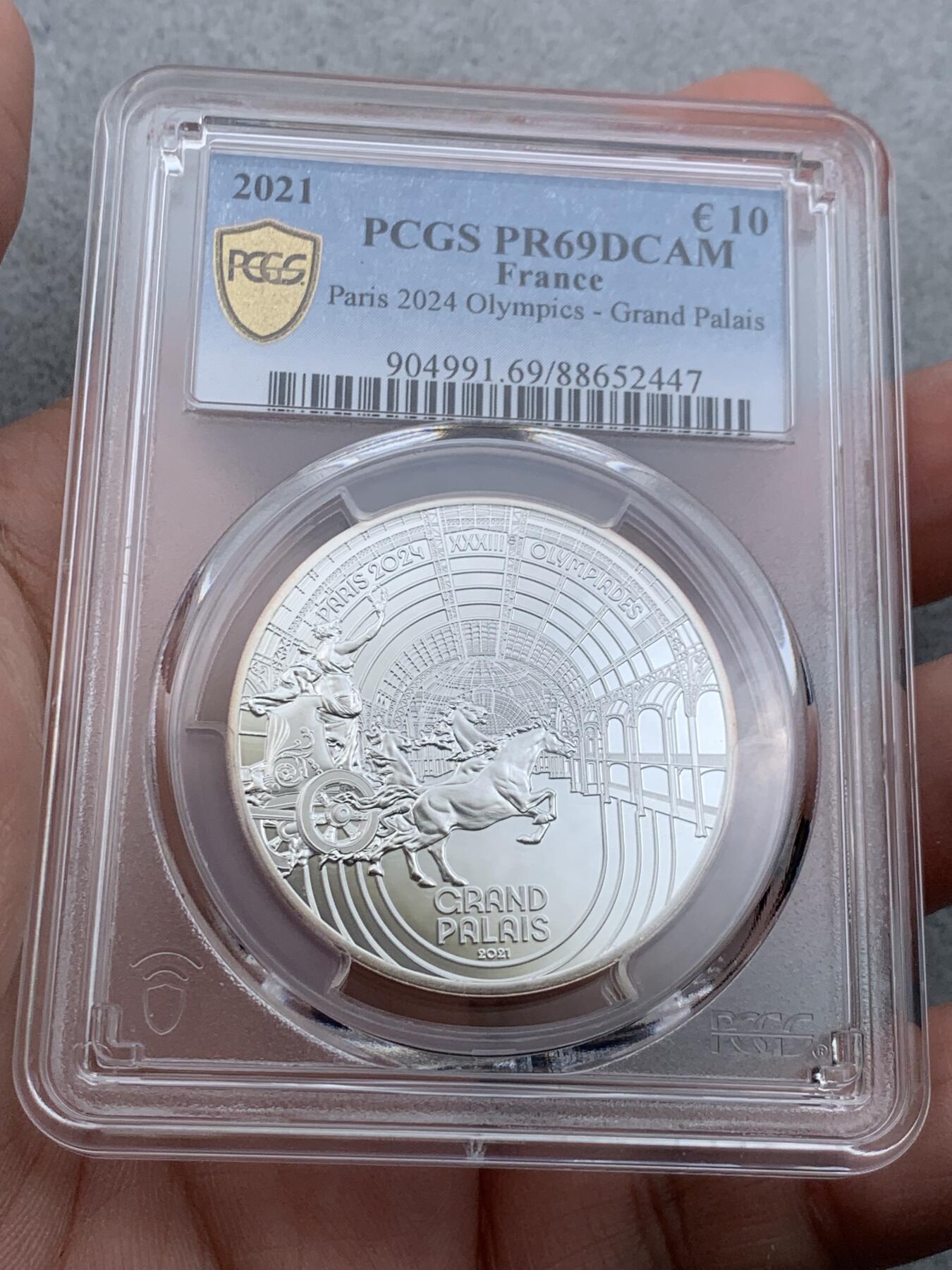 《竞宝斋》第326场 周日，周一，2场连拍 （全场包邮） PCGS PR69DCAM 法国2021年巴黎奥运会历史遗产系列-巴黎大皇宫10欧元精制纪念币（个人认为奥运会纪念币中最美丽的一枚，克重22.2克，999纯银，限量7500枚，盒证齐全）