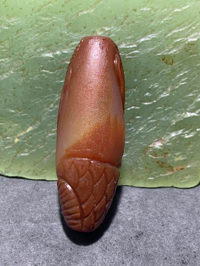 精美亚光冻料战国红玛瑙手工俏色巧雕红龙鱼桶珠一个 精美亚光冻料战国红玛瑙手工俏色巧雕红龙鱼桶珠一个