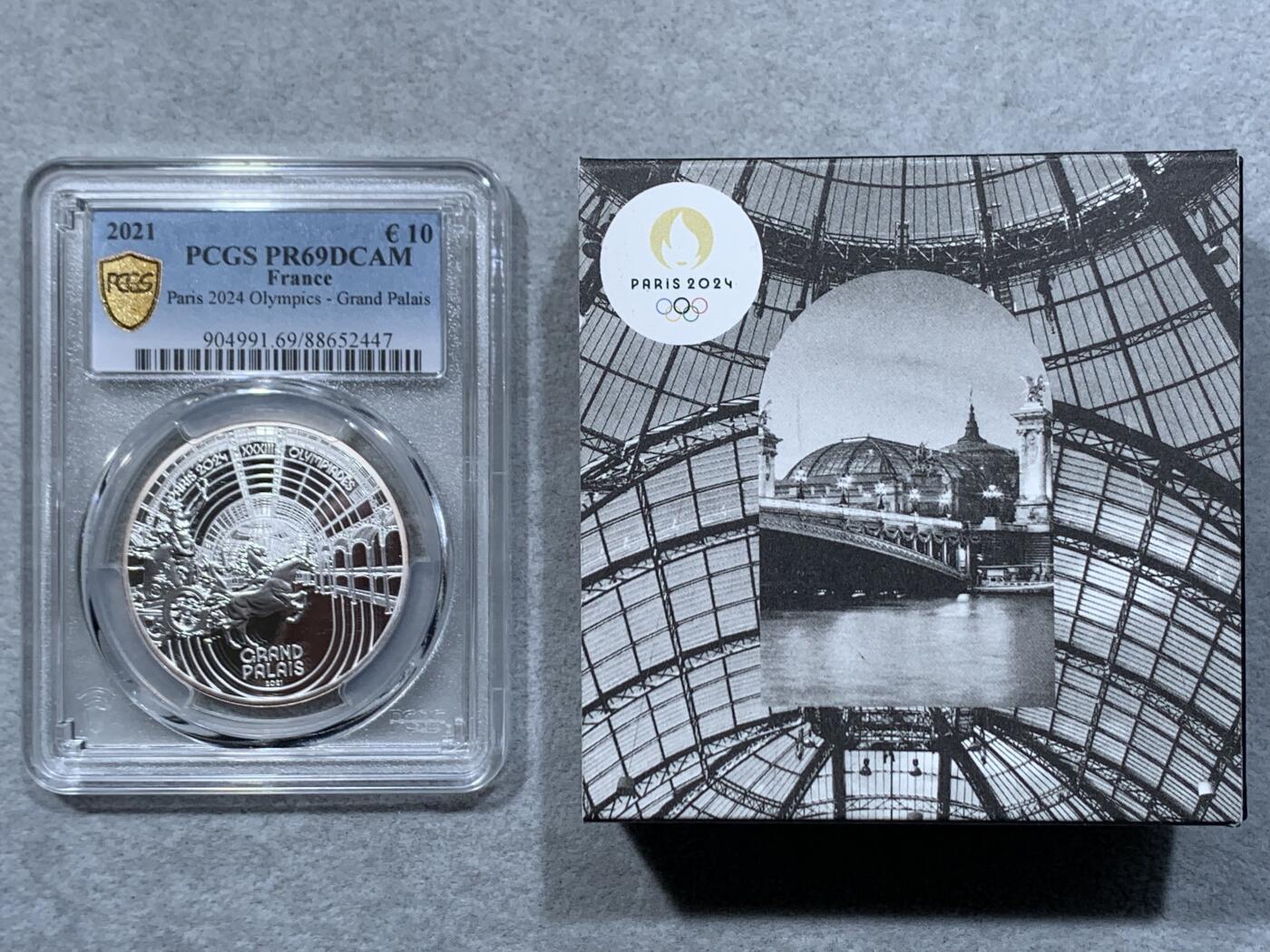 《竞宝斋》第334场 周日，周一 2场连拍 （全场包邮） PCGS PR69DCAM 法国2021年巴黎奥运会历史遗产系列-巴黎大皇宫10欧元精制纪念币（个人认为奥运会纪念币中最美丽的一枚，克重22.2克，999纯银，限量7500枚，盒证齐全）