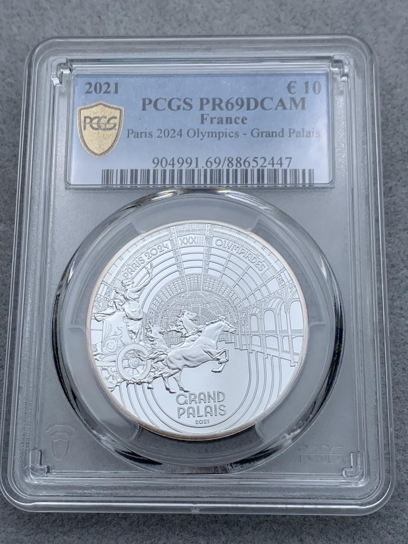 《竞宝斋》第334场 周日，周一 2场连拍 （全场包邮） PCGS PR69DCAM 法国2021年巴黎奥运会历史遗产系列-巴黎大皇宫10欧元精制纪念币（个人认为奥运会纪念币中最美丽的一枚，克重22.2克，999纯银，限量7500枚，盒证齐全）