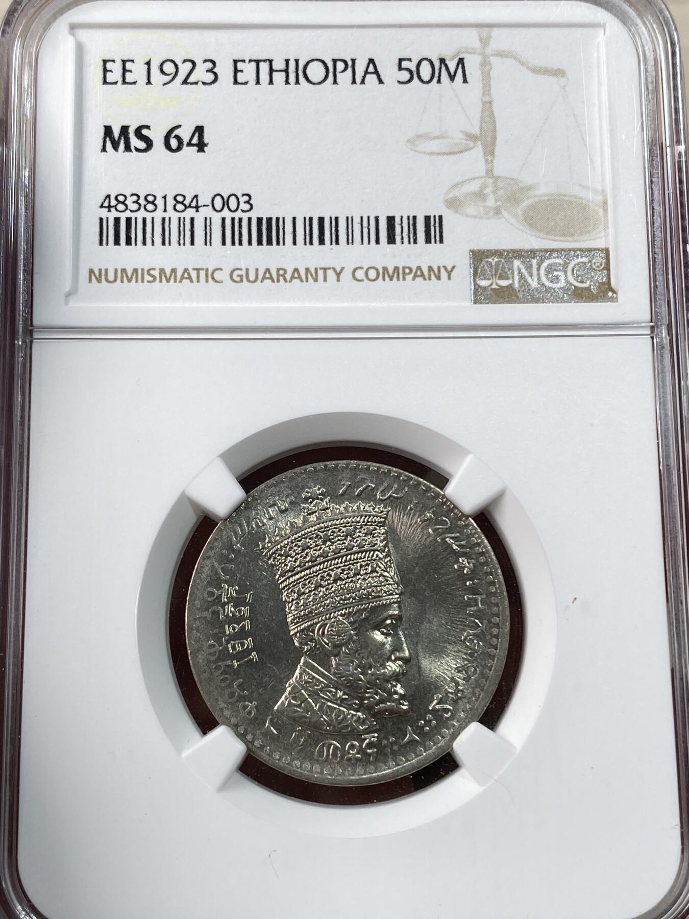 万国钱币拍卖第038期 NGC MS64 1930年埃塞俄比亚50马托雅思 单年发行品种，正面是头戴王冠的大胡子非洲国王，细节极佳，背面就是经典的右扛旗雄狮，高分罕见，NGC亚军分，更高仅一枚。	 