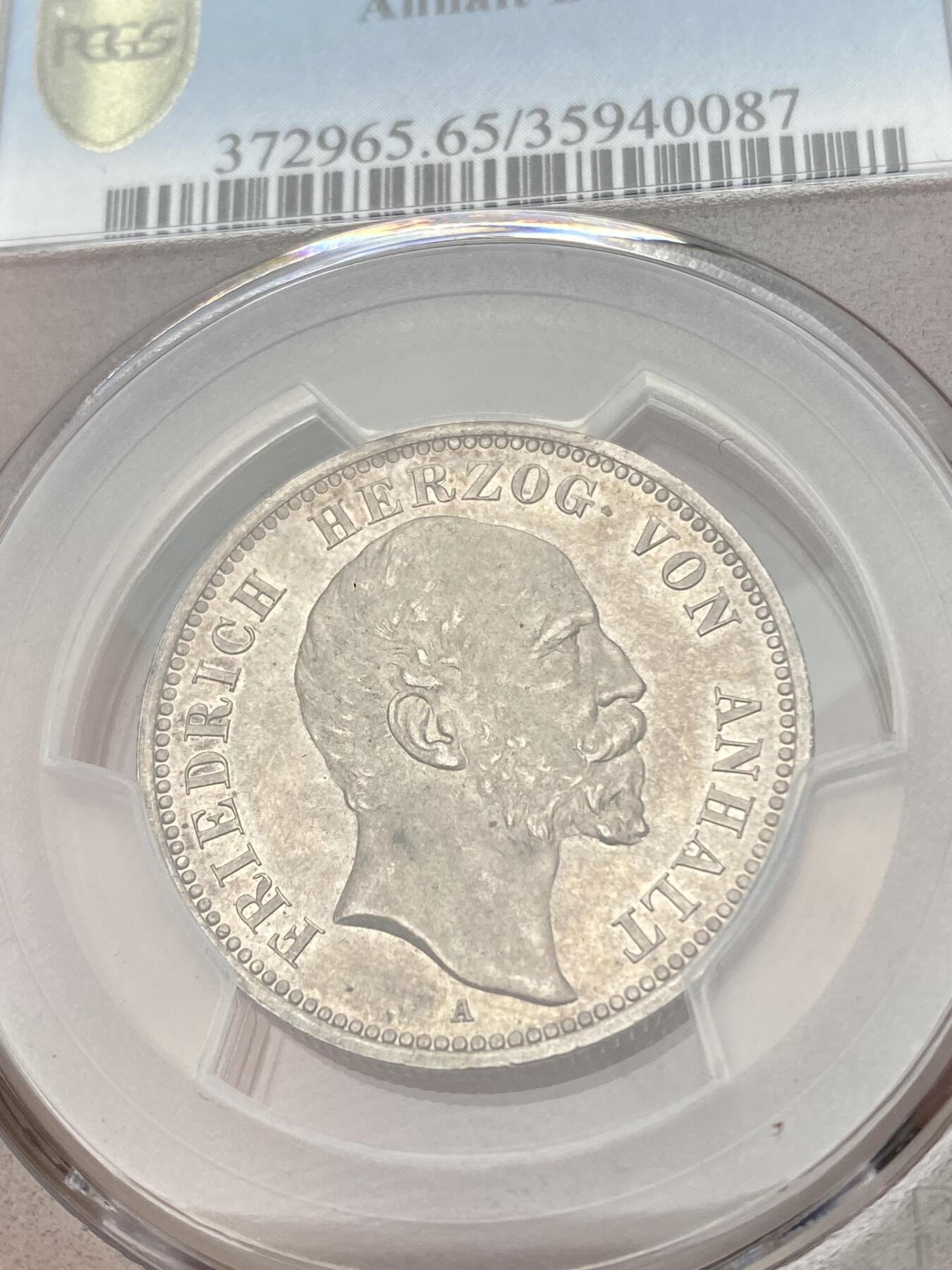 万国钱币拍卖第038期 PCGS MS65 1896年德国安哈尔特-德邵长翅2马克 2马克中的高难小邦品种，单年发行，顶级原味品相。