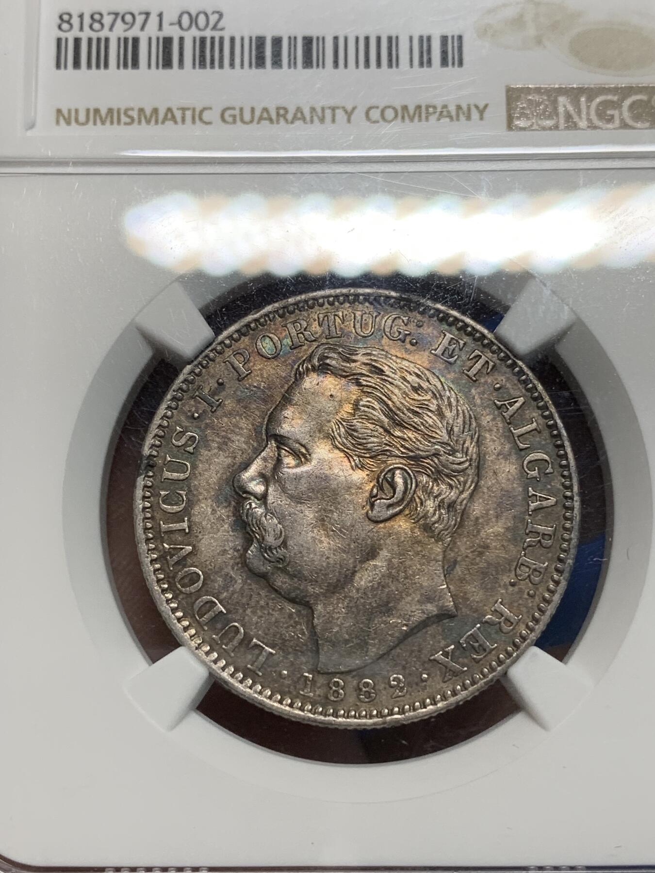 《竞宝斋》第335场 周日，周一 2场连拍 （全场包邮） NGC AU50 葡属印度1882年1卢比 原味淡紫金包浆，细节状态到位。 书价xf40-120美金 远比英属卢比稀少