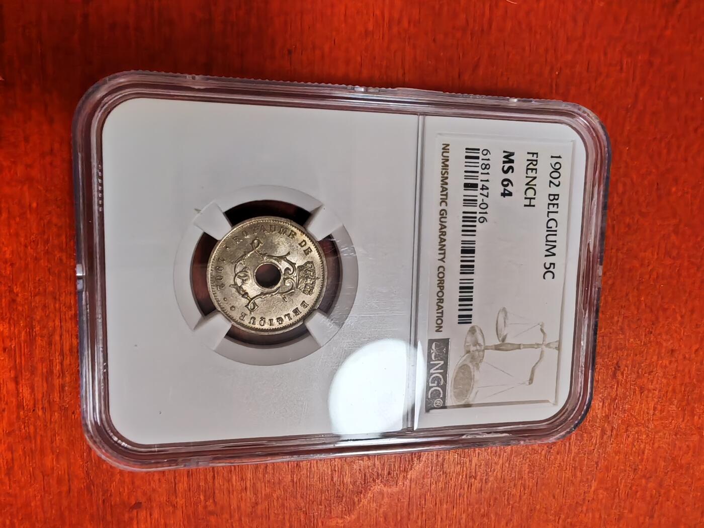 长老汇龙年精选第三十五场拍卖  1902 比利时5分中孔铜镍币，NGC MS64分，法语版，季军分，更高分仅有3枚