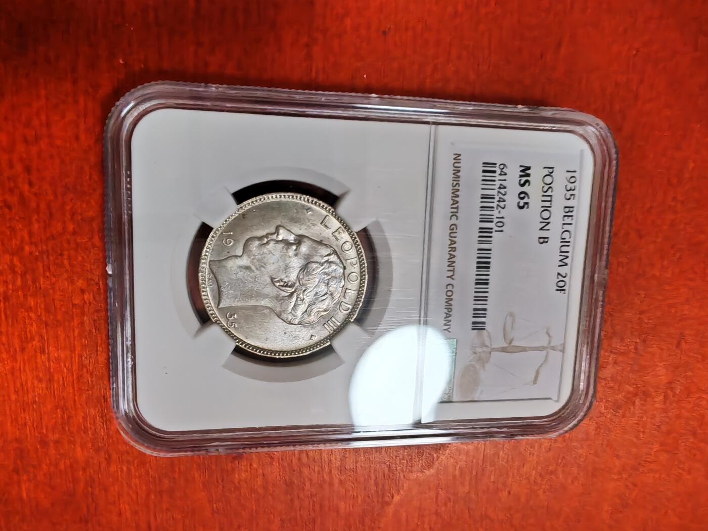 长老汇龙年精选第三十五场拍卖 1935 比利时20法郎银币，NGC MS65分，POSITION B，唯一亚军分，更高分仅有1枚