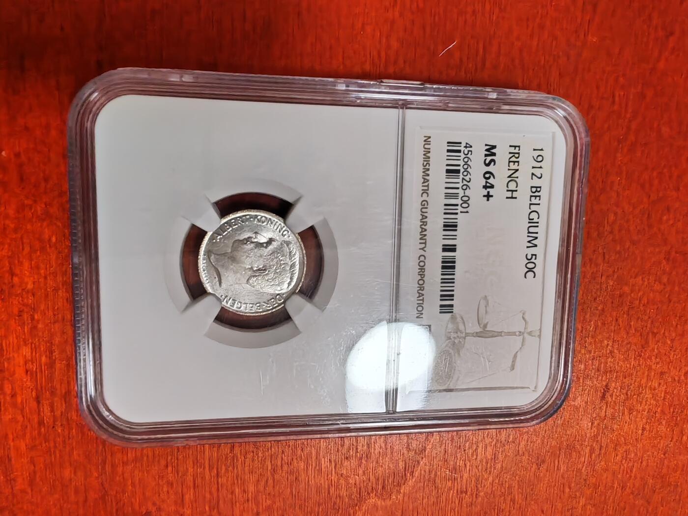 长老汇龙年精选第三十五场拍卖 1912 比利时50分银币，NGC MS64+，法语版，唯一冠军分