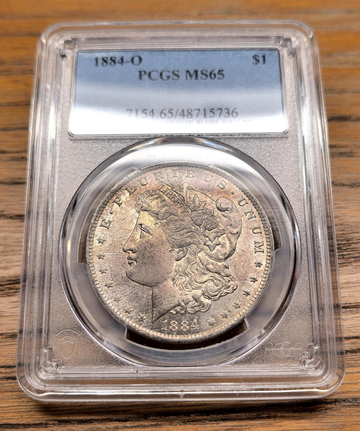 凡希社世界钱币微拍第二百九十三期 1884O美国摩根壹元PCGS-MS65，卷首币。