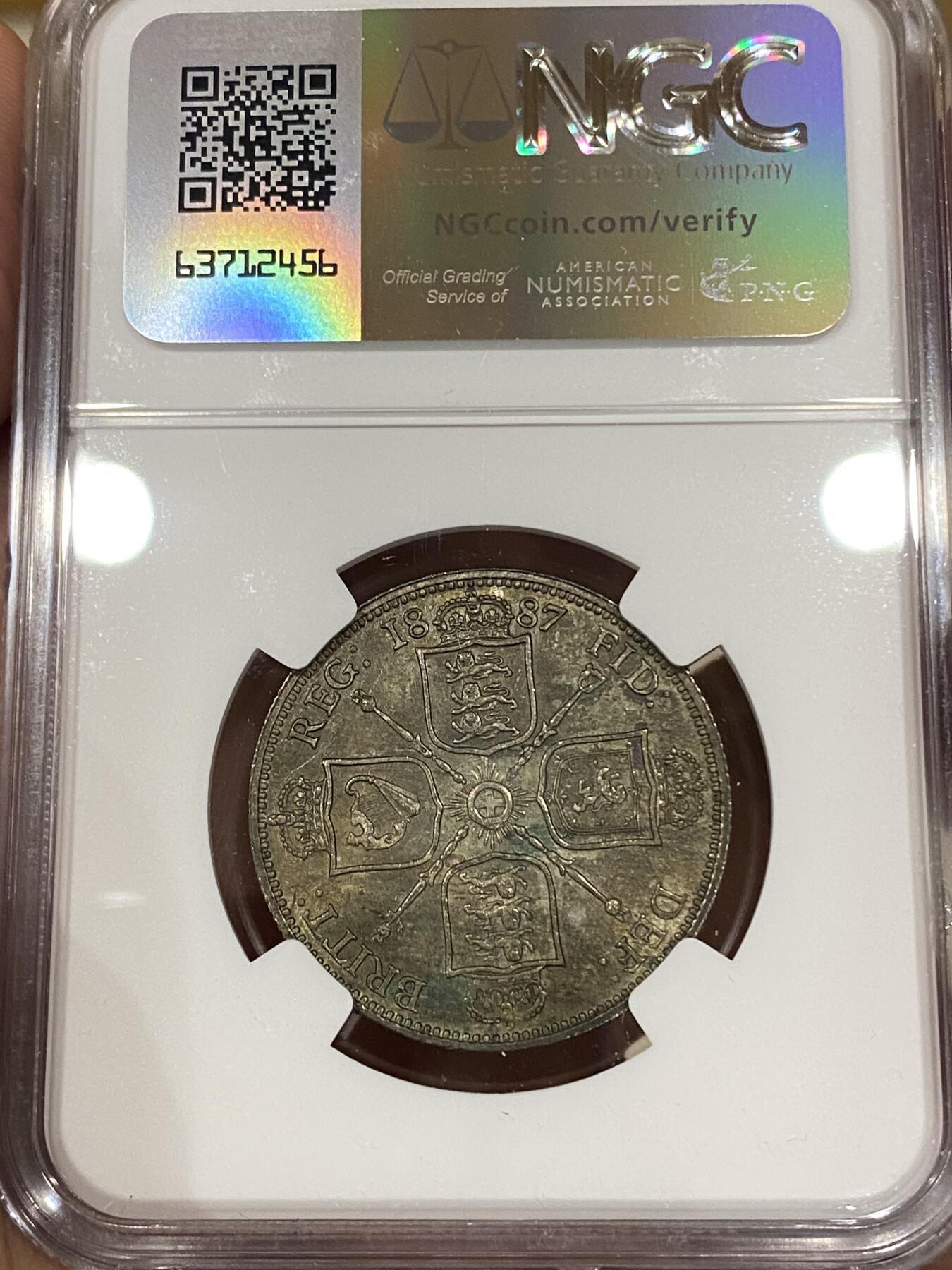 万国钱币拍卖第039期 NGC MS64 1887英国维多利亚女王高冠弗洛林 原味五彩。