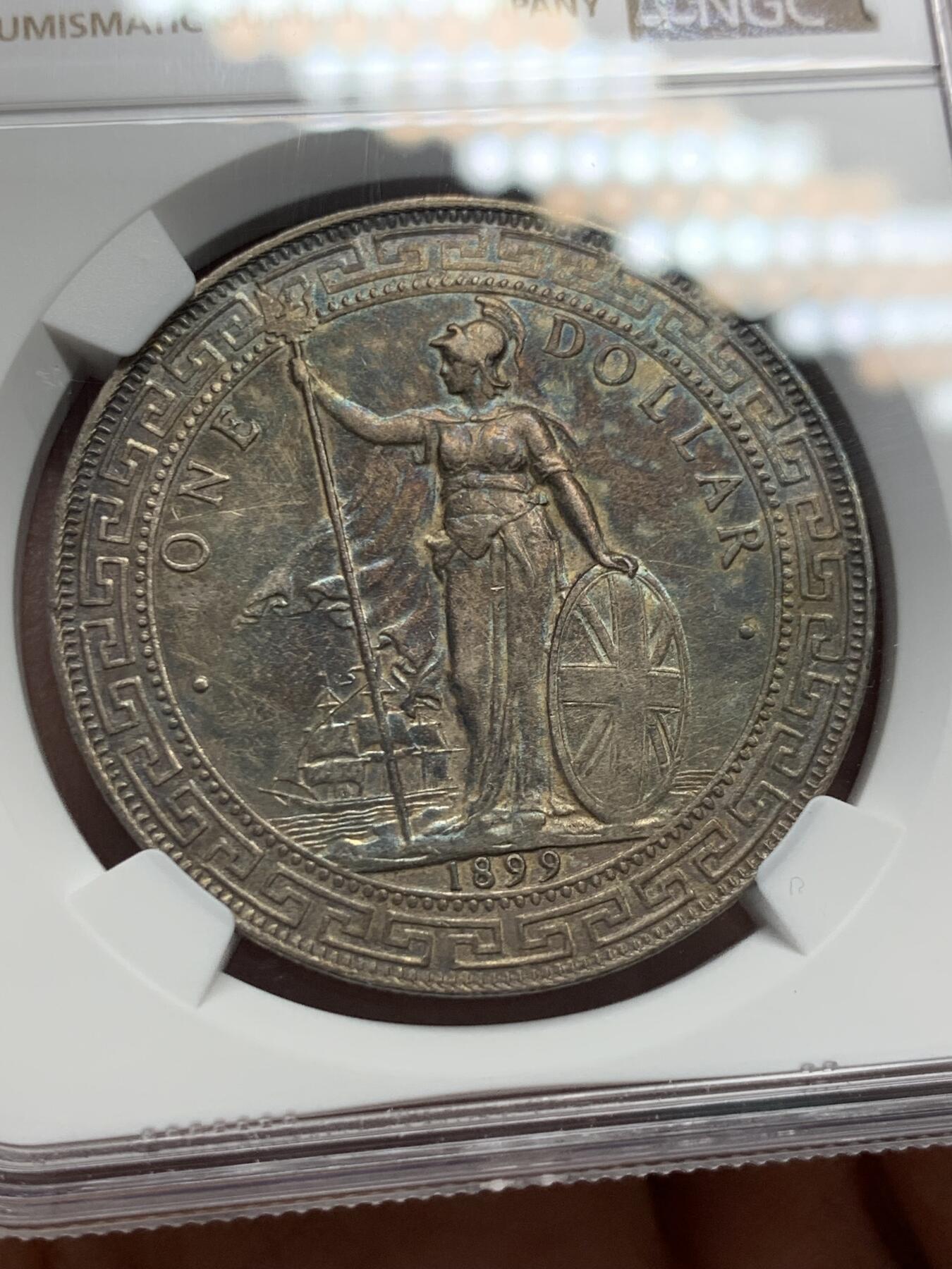 《竞宝斋》第338场 周日，周一，周二 3场连拍 （全场包邮） NGC AU 英国1899站洋一元au品，带彩带底光，细节清楚不错