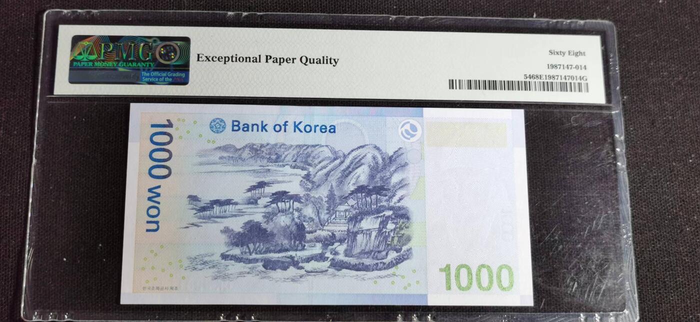 刘世昌艺术品销售中心～虎踞龙蟠*金杨在线联拍群第514期 韩国2007年1000元（PMG   68E   号码：CK3281124J）1枚。