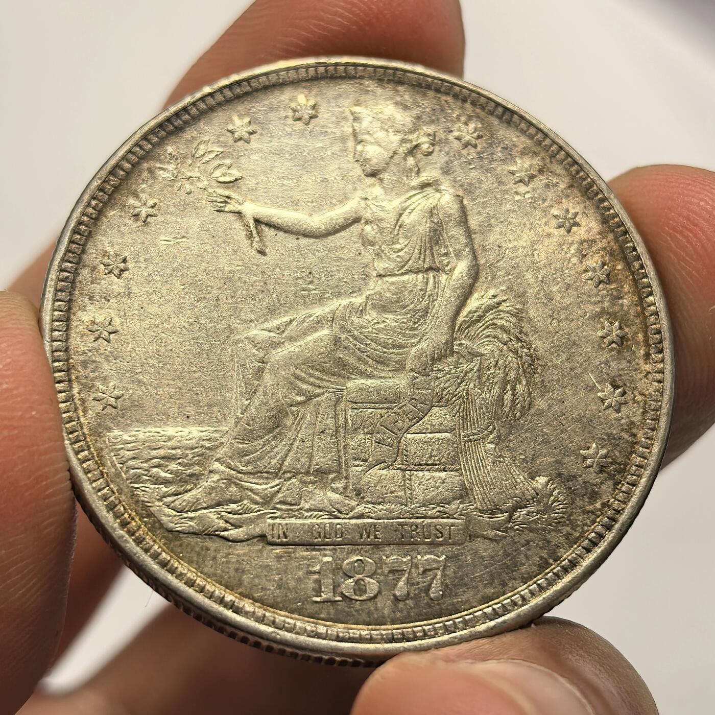 博洋堂世界钱币拍卖第104期（全场包邮） 贸易银币中的名誉品，1877美国拿花大银币，人物、文字和老鹰轮廓清晰深打，币面基本无磨损，转光品质