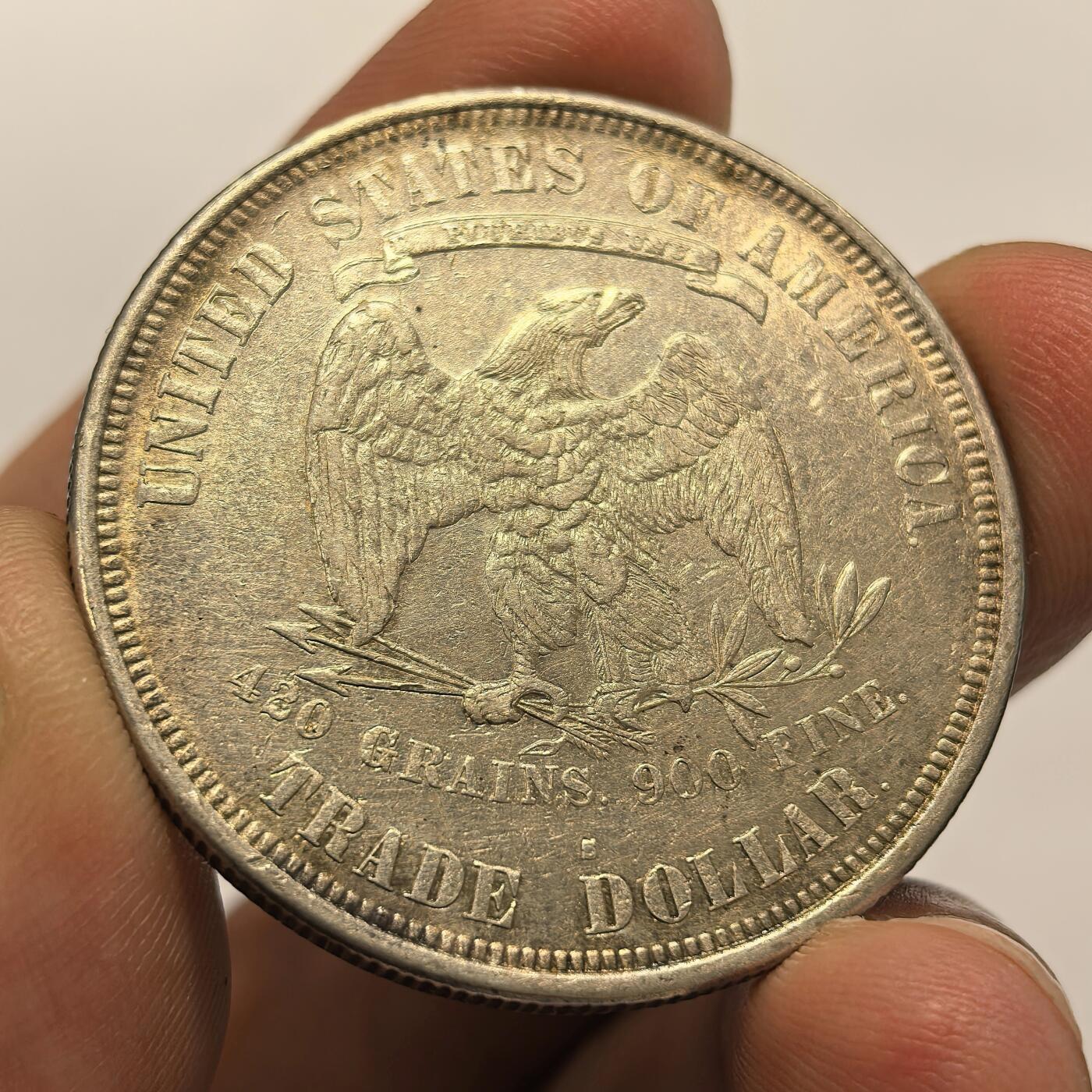 博洋堂世界钱币拍卖第104期（全场包邮） 贸易银币中的名誉品，1877美国拿花大银币，人物、文字和老鹰轮廓清晰深打，币面基本无磨损，转光品质