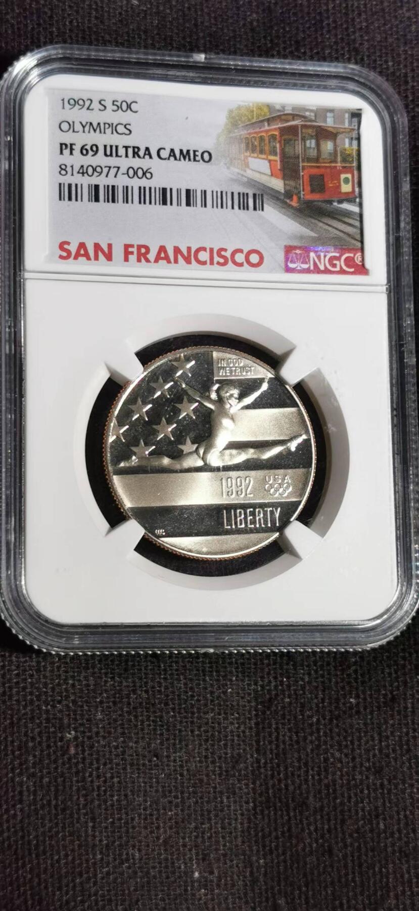 刘世昌艺术品销售中心～虎踞龙蟠*金杨在线联拍群第518期 美国1992年“巴塞罗那奥运会~自由体操”半美元精制纪念币（NGC   PF69UC   串号：8140977-006）1枚。