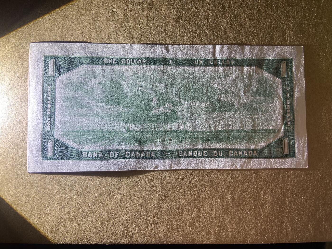 【炜奕收藏】，二十一期 【无47】加拿大1954年1元，UNC品相，号码无47