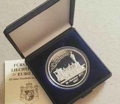 【币将精彩】世界钱币拍卖拍卖（2026-5-6） 列支敦士登1997年铁路125周年纪念银币 925 银25克，直径38.61毫米 瑞士瓦尔冈比造币厂制造，原盒证书 