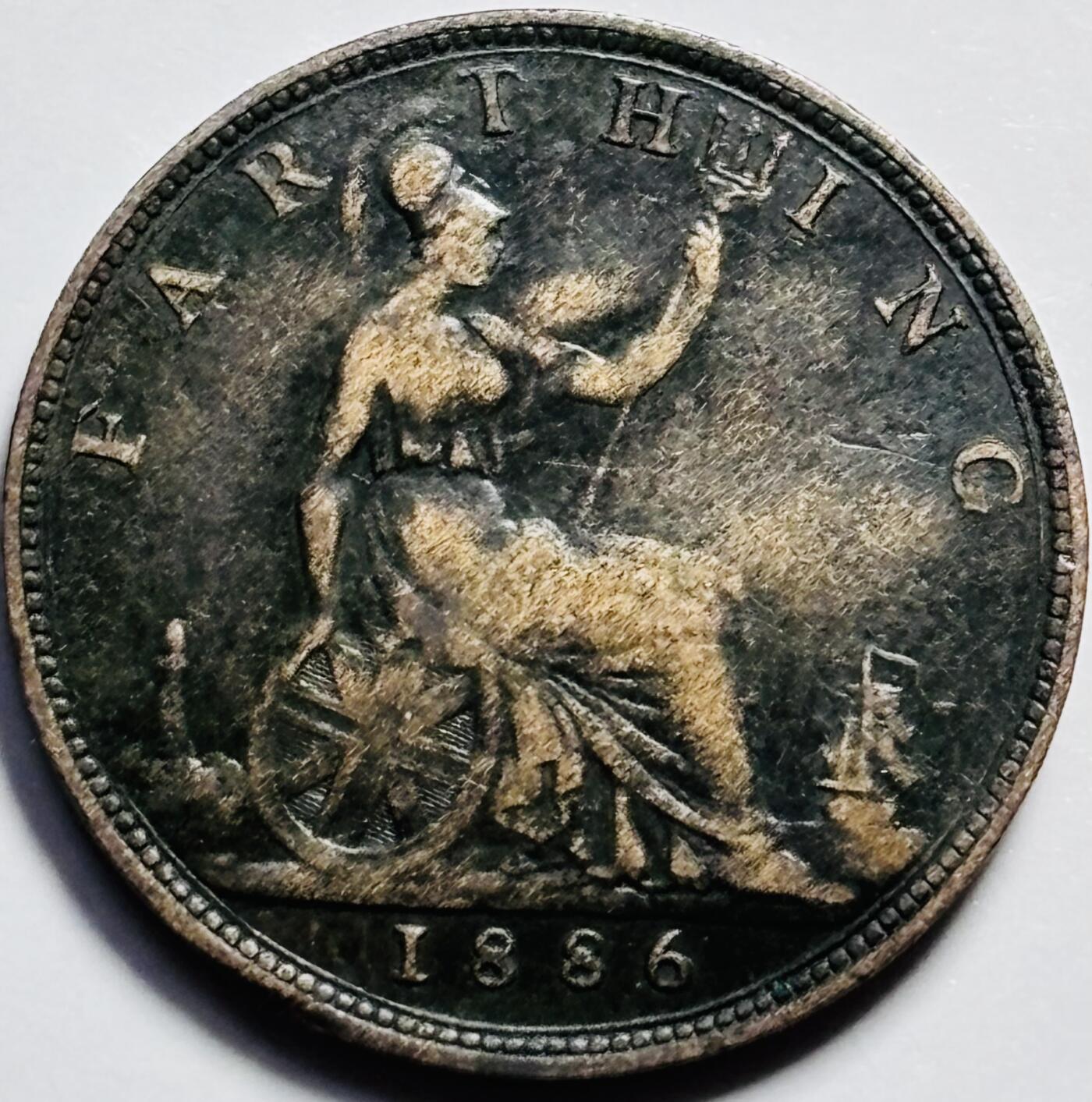 文馨钱币收藏第 203 场，英系套册纪念币，古铜币 1886 年英国维多利亚双辫子版法新古铜币，看着像铸痕，不像流通划伤