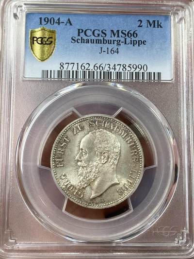 万国钱币拍卖第040期（万国2025新年大拍） - PCGS MS66 1904绍姆堡-利普流通长翅2马克 两年各发行5000枚的顶级小邦品种，原味淡彩，肉眼无暇，闪耀着宝石般光泽的顶级GEM品相。