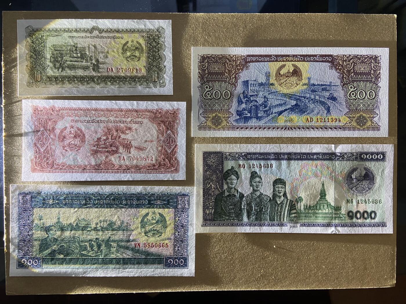 【炜奕收藏】，第二十二期 老挝10-100000吉普，UNC品相，2003年以前版本