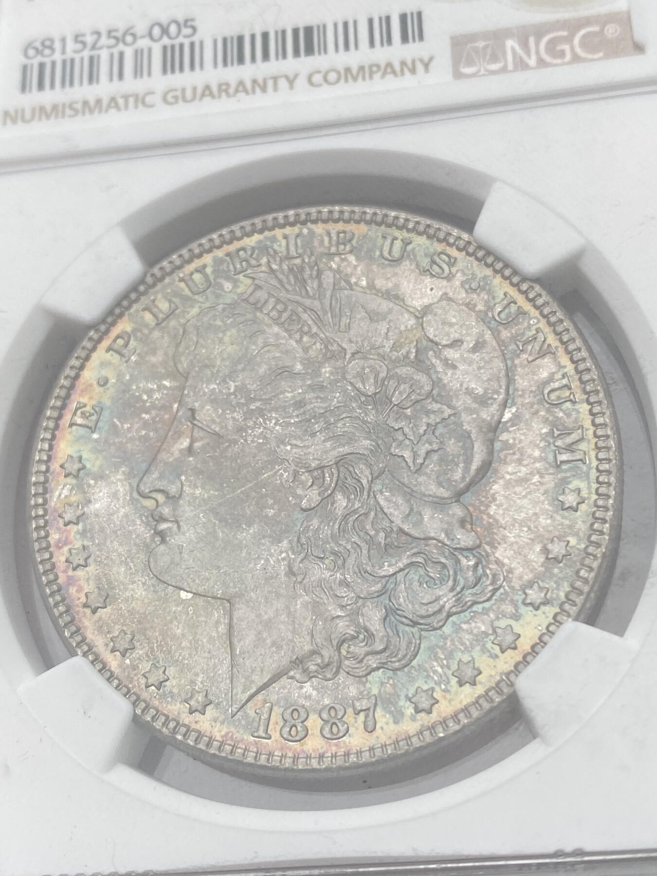 万国钱币拍卖第040期（万国2025新年大拍） NGC MS66 1887年美国摩根女神1元银币 七彩倒影包浆顶级收藏品质