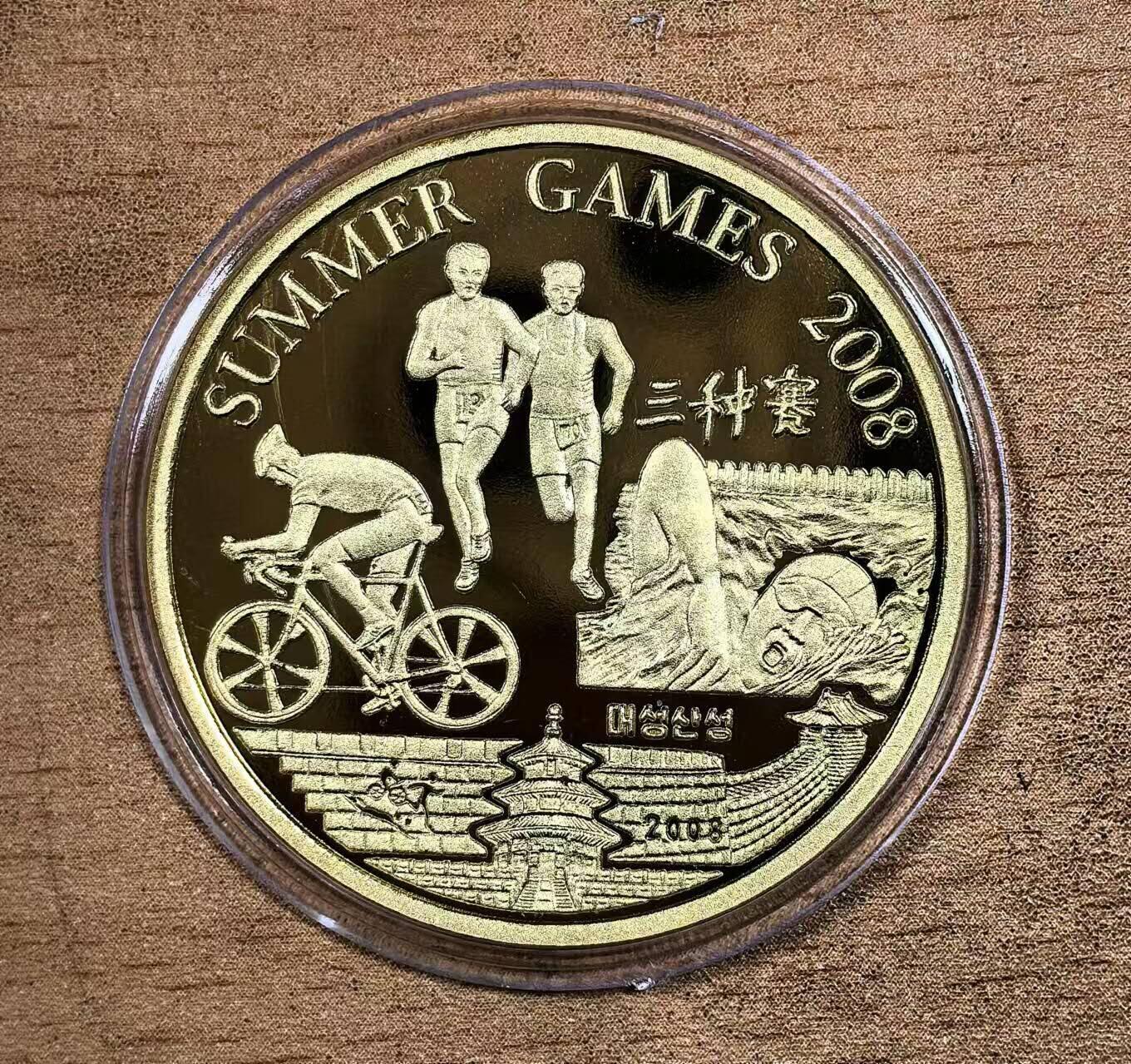 北京马甸外国币专卖微拍第132期，外国非贵金属纪念币，流通币专场，陆续上新，欢迎关注  2008年朝鲜发行北京奥运会纪念铜币错版币之：铁人三项赛写成三种赛